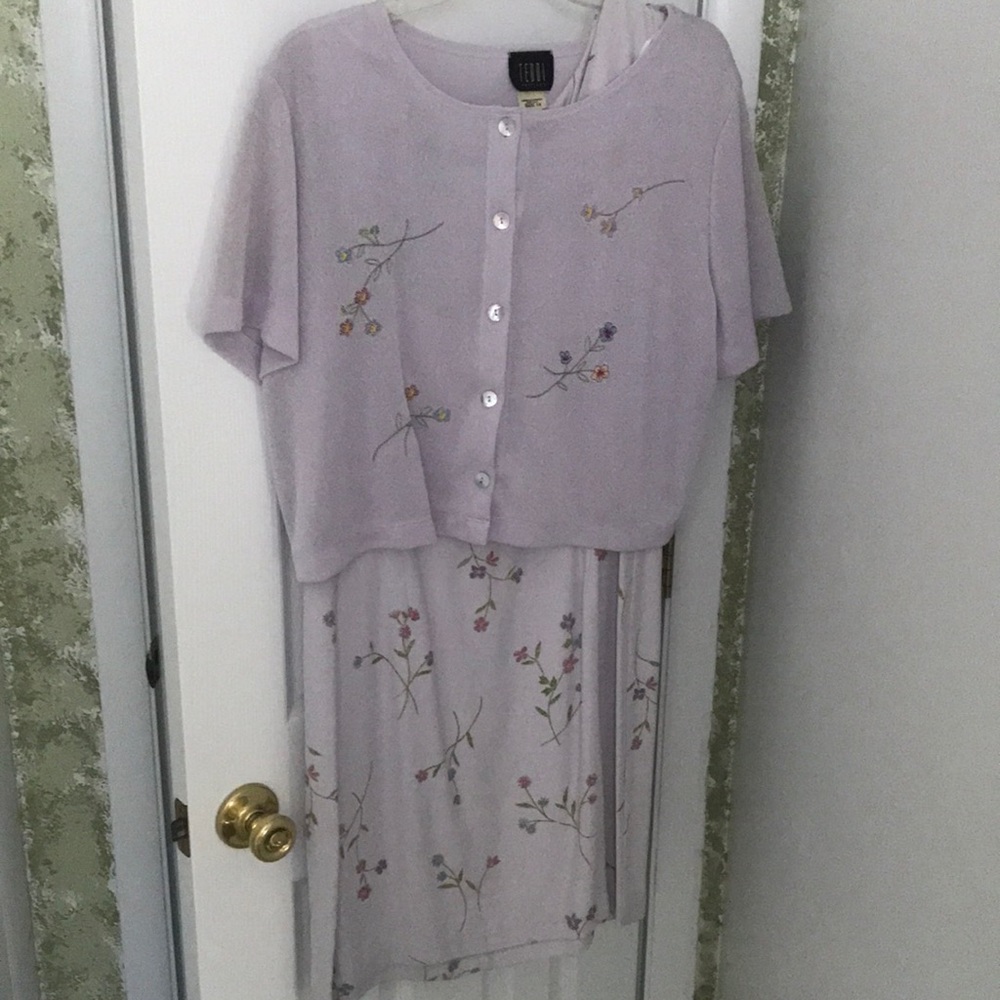 Light colored purple zip up dress with overlaying sweater. Floral design